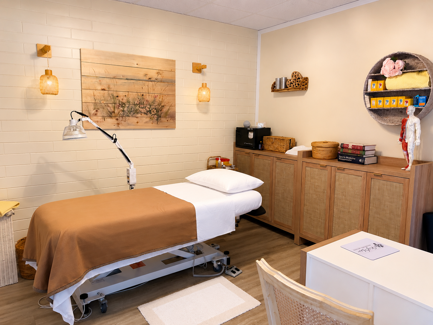 Bright acupuncture treatment room at Victoria Healing Space in Victoria BC with an adjustable treatment table and modern Chinese Medicine equipment.